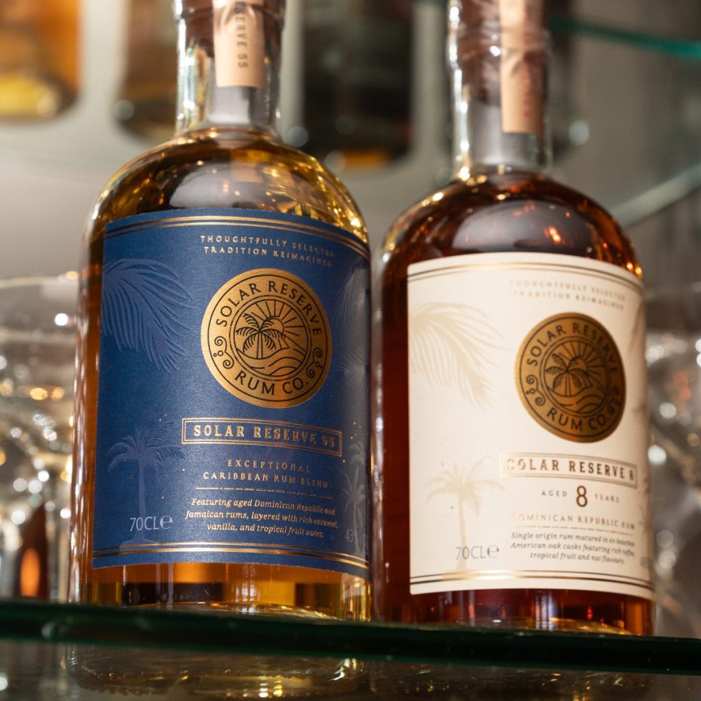 Premium rum bottles showing blue and cream labels, gold foil, embossing, and clear hierarchy.